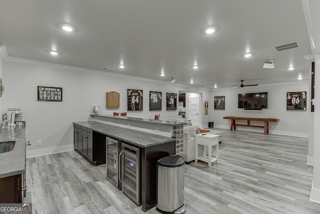 4621 Stanley Rd, Flowery Branch, GA 30542 - kitchen with ornamental molding, ceiling fan, beverage cooler, light wood-type flooring, and recessed lighting