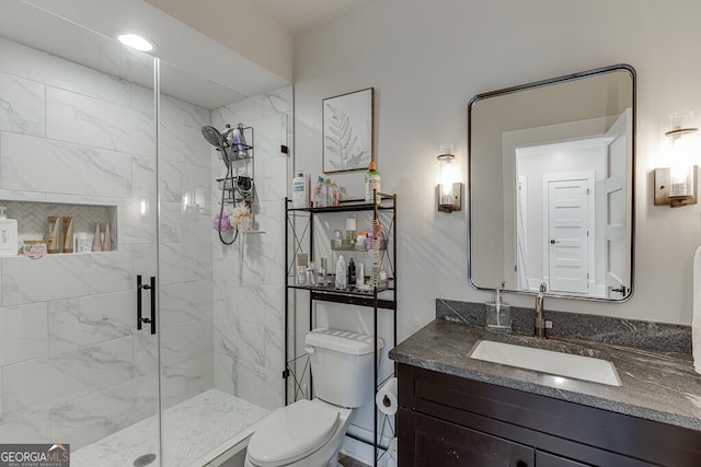 4621 Stanley Rd, Flowery Branch, GA 30542 - bathroom with a shower stall, toilet, and vanity