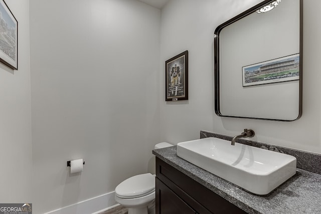 4621 Stanley Rd, Flowery Branch, GA 30542 - bathroom featuring toilet and vanity