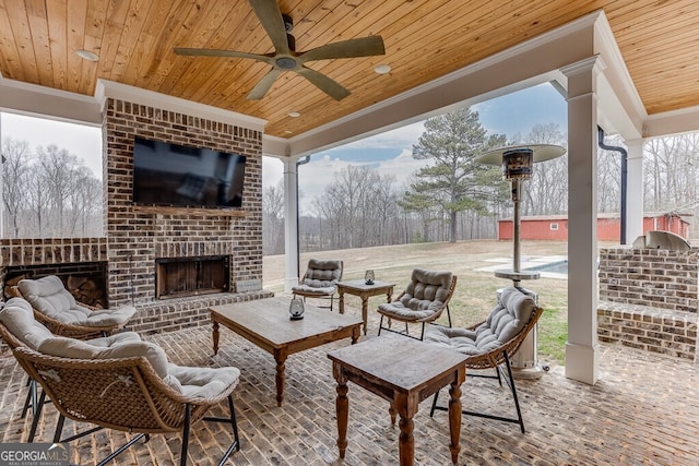 4621 Stanley Rd, Flowery Branch, GA 30542 - view of patio / terrace with an outdoor living space with a fireplace and a ceiling fan