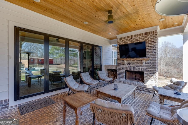 4621 Stanley Rd, Flowery Branch, GA 30542 - view of patio featuring an outdoor living space with a fireplace