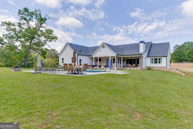 4621 Stanley Rd, Flowery Branch, GA 30542 - rear view of property featuring a patio area, a chimney, and a yard