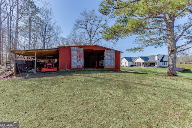 4621 Stanley Rd, Flowery Branch, GA 30542 - view of pole building featuring a yard