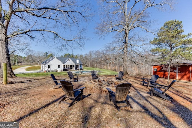 4621 Stanley Rd, Flowery Branch, GA 30542 - view of grassy yard featuring an outbuilding