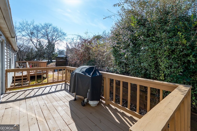 wooden deck with grilling area