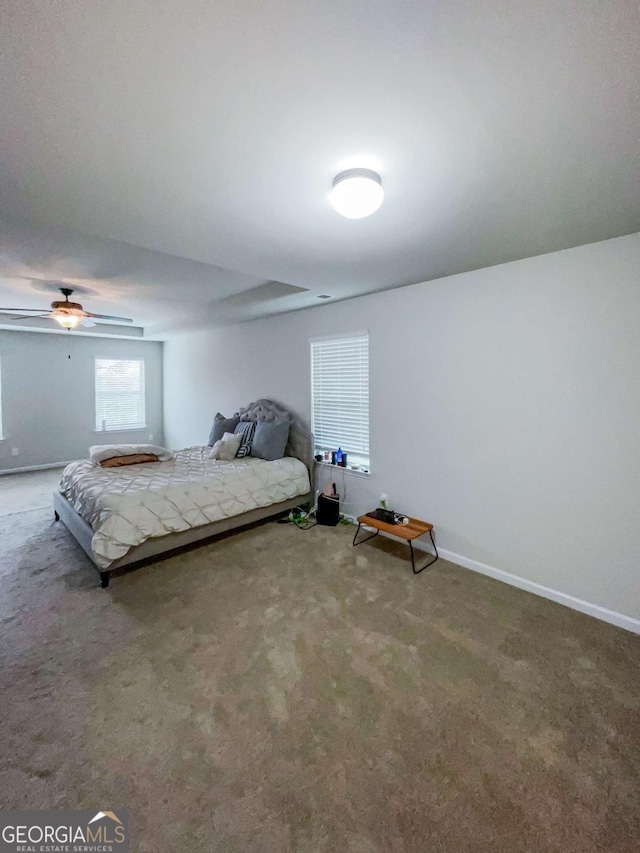 bedroom with ceiling fan and carpet flooring