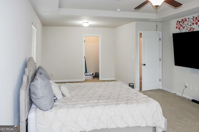 bedroom featuring ceiling fan and light carpet