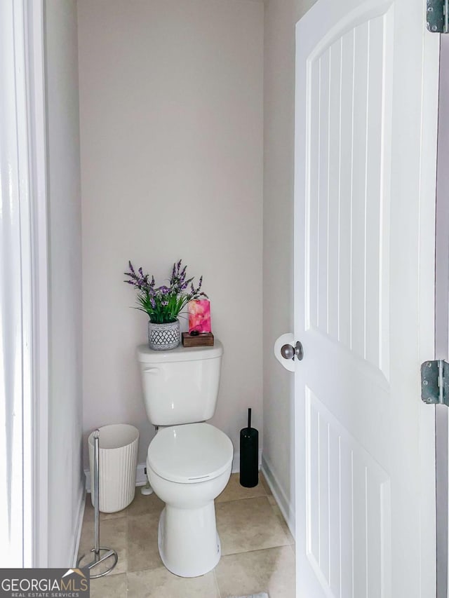 bathroom featuring tile patterned floors and toilet