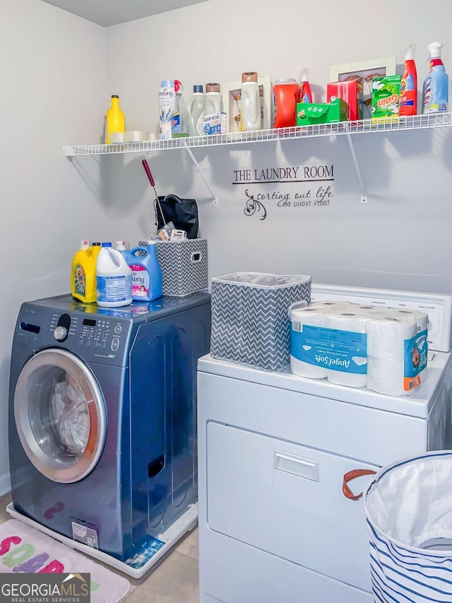 clothes washing area with independent washer and dryer