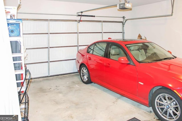 garage featuring a garage door opener