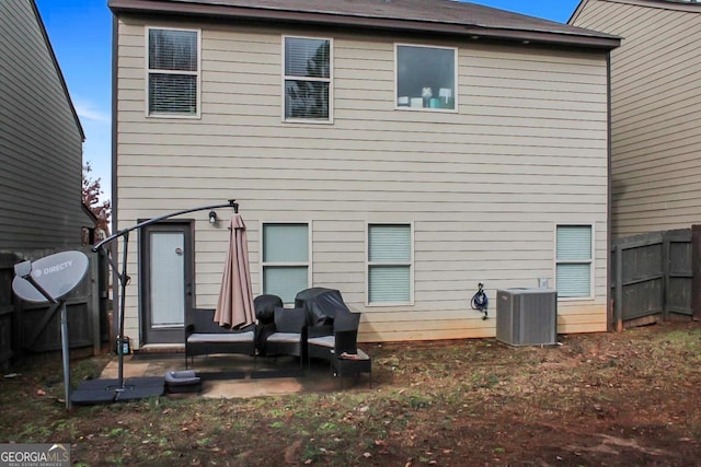 rear view of house featuring a patio area and central air condition unit