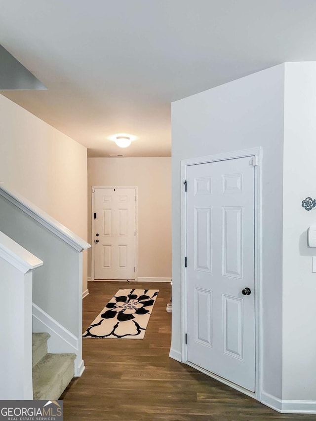 foyer featuring dark hardwood / wood-style floors