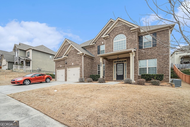 front of property featuring a garage and central AC