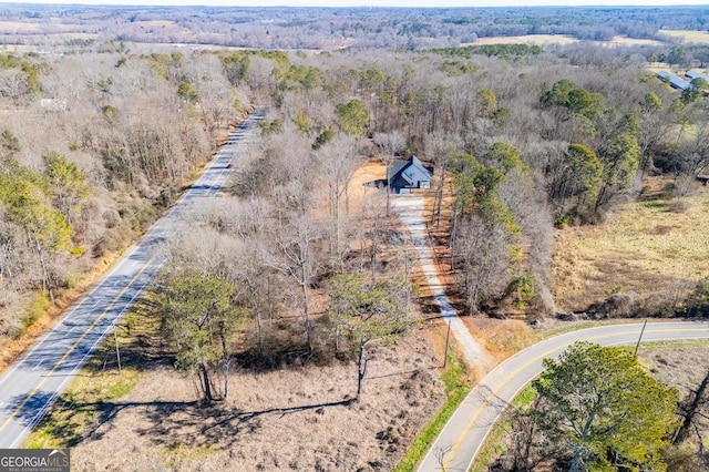 aerial view with a wooded view