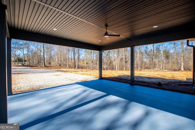 view of patio featuring a ceiling fan and a carport