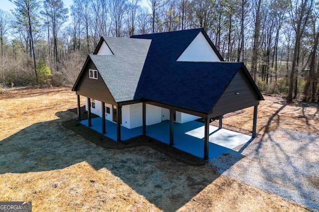 view of side of property with a lawn