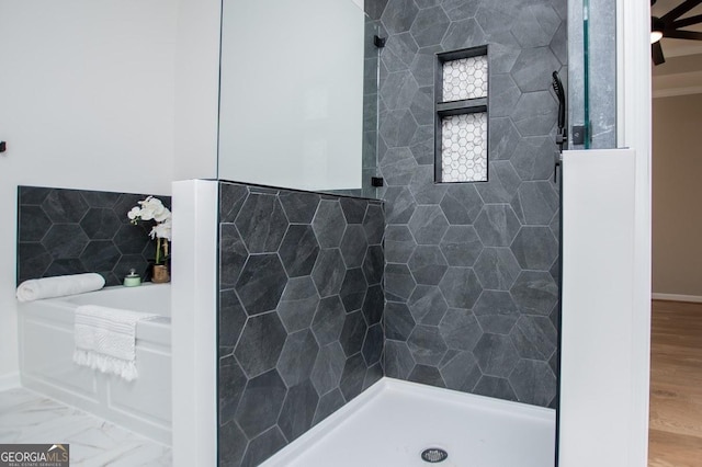 full bathroom with a tile shower