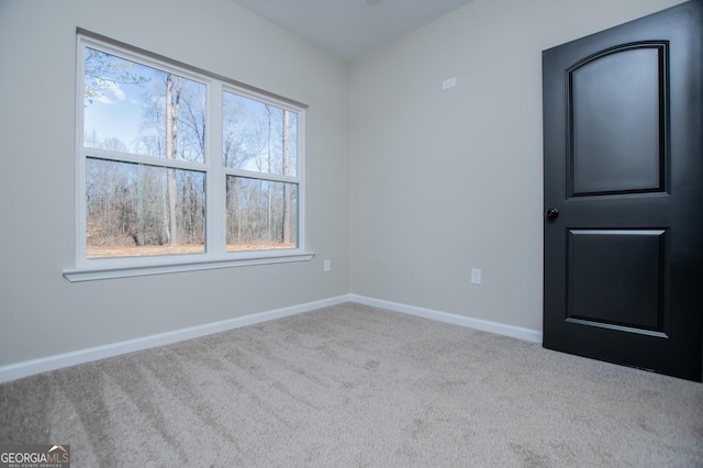 spare room with light carpet