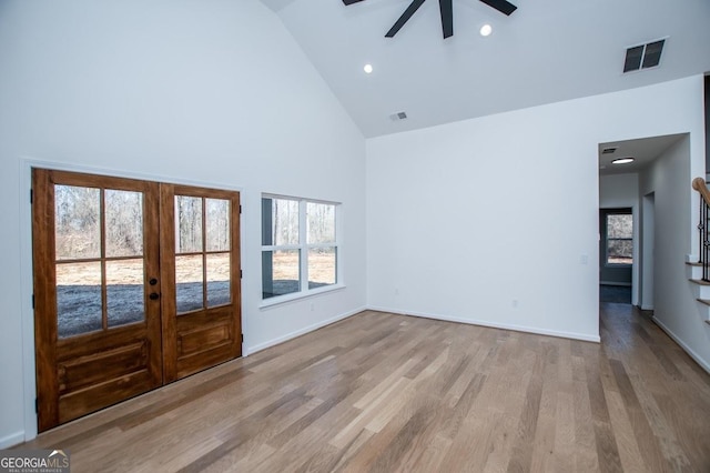 interior space featuring high vaulted ceiling, wood finished floors, visible vents, and recessed lighting