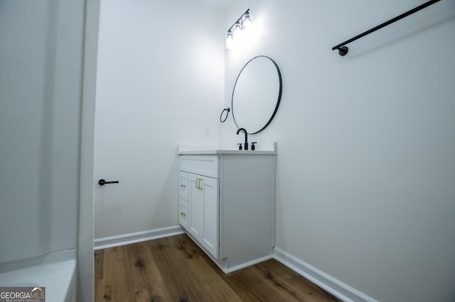 bathroom with vanity and wood-type flooring