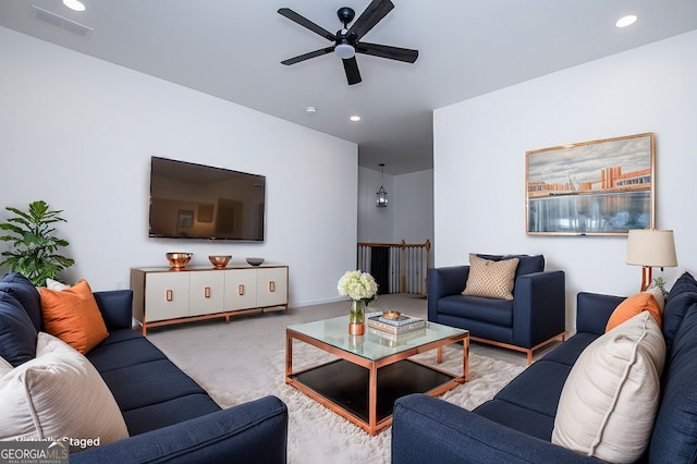 living area with a ceiling fan, recessed lighting, carpet flooring, and visible vents