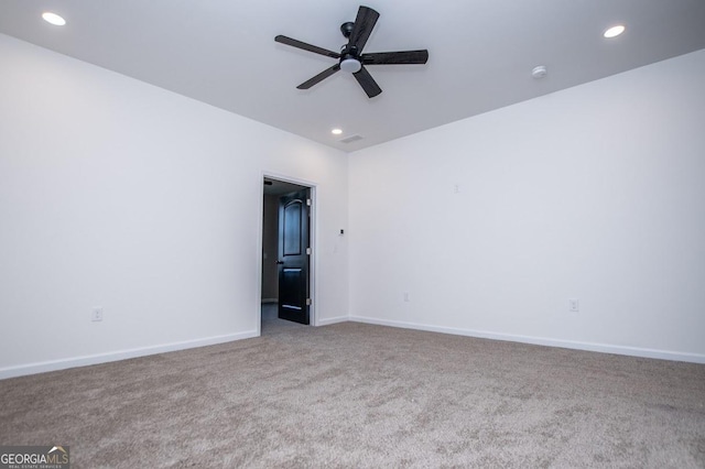 carpeted spare room featuring recessed lighting, ceiling fan, and baseboards