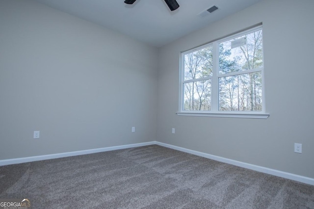 empty room with baseboards, carpet, and a healthy amount of sunlight