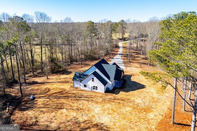 aerial view with a wooded view