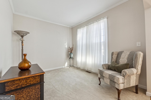 sitting room with light colored carpet and crown molding