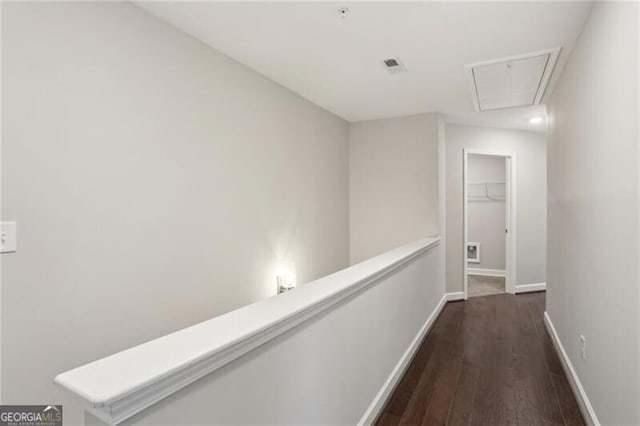 hallway with dark wood-type flooring