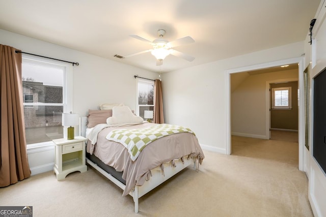 carpeted bedroom featuring ceiling fan