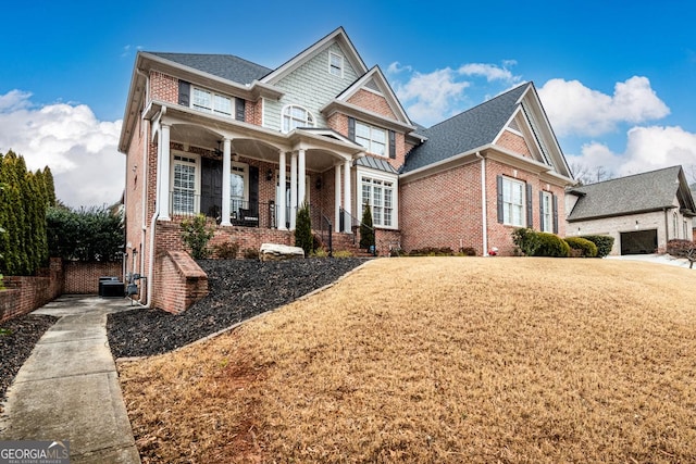 view of front of house featuring a front yard and a porch