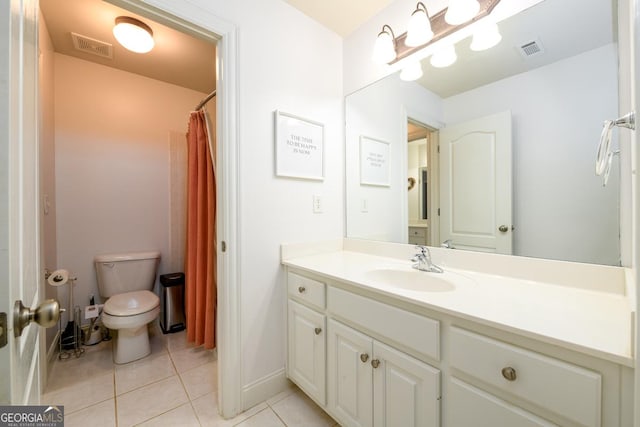 bathroom with a shower with curtain, toilet, tile patterned floors, and vanity