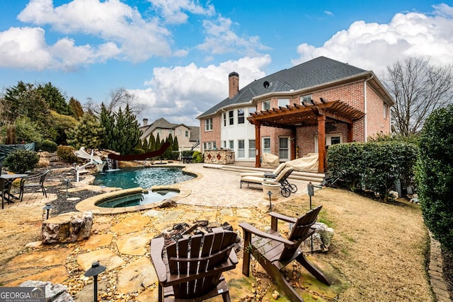 rear view of property with a patio area, a pool with hot tub, and a pergola