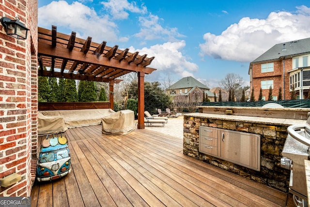 deck with a patio and a pergola