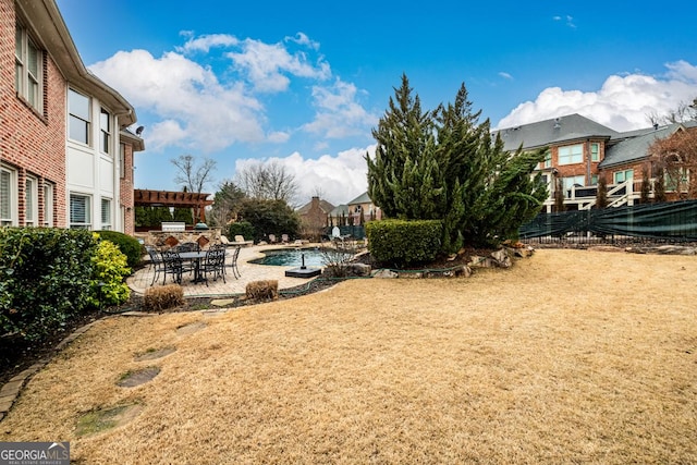 view of yard with a patio area and a pergola