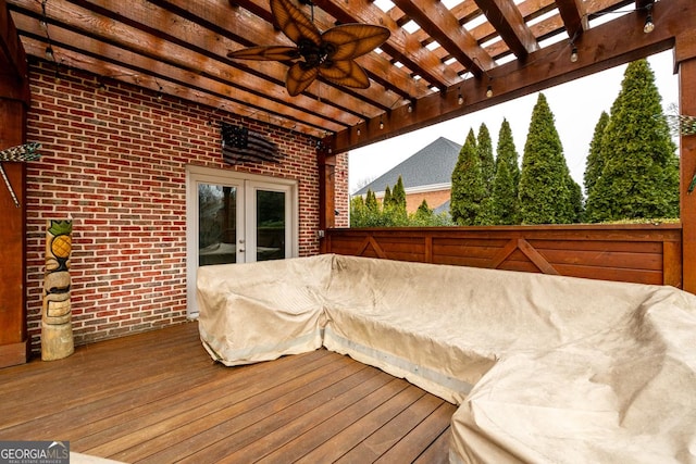 deck featuring ceiling fan, french doors, and a pergola