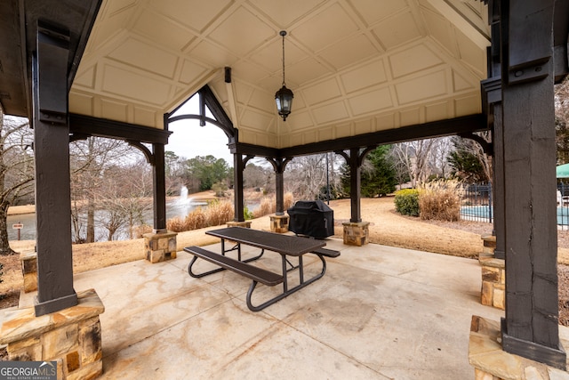 view of patio / terrace with a water view and grilling area