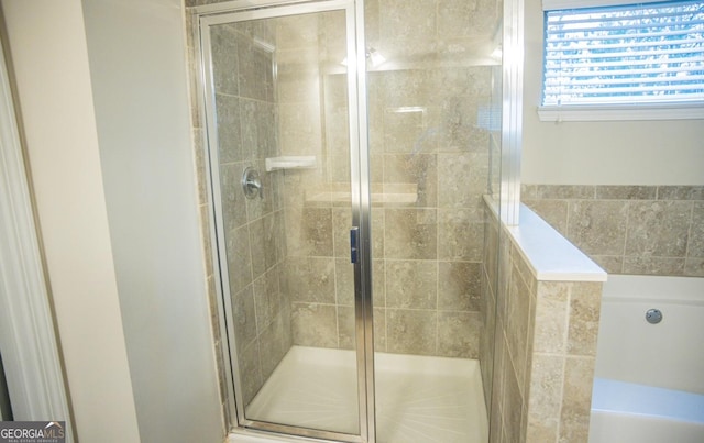 bathroom with a shower with shower door