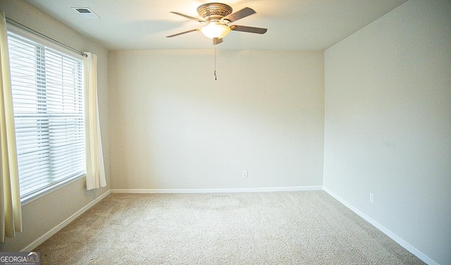 carpeted empty room with ceiling fan