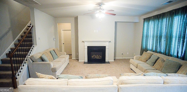 living room featuring light colored carpet and ceiling fan