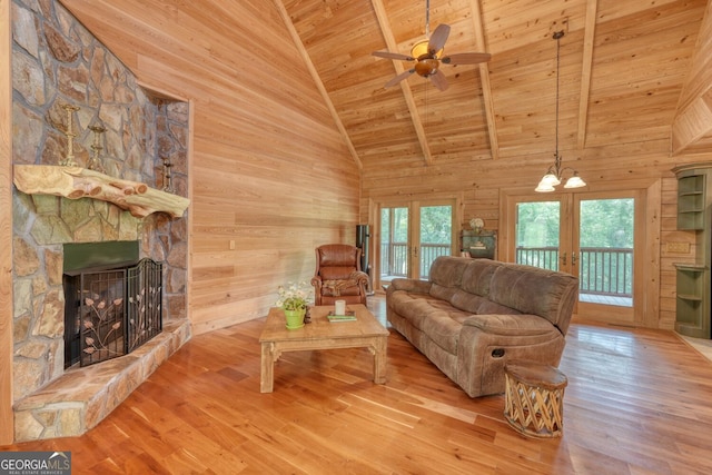 130 Stablegate Dr, Blairsville, GA 30512 - living area featuring wood ceiling, wooden walls, wood finished floors, french doors, and ceiling fan