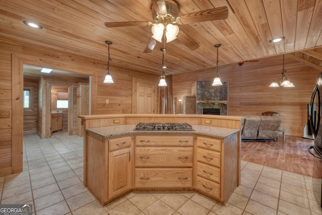 130 Stablegate Dr, Blairsville, GA 30512 - kitchen featuring stainless steel gas cooktop, wood walls, a fireplace, wood ceiling, and open floor plan