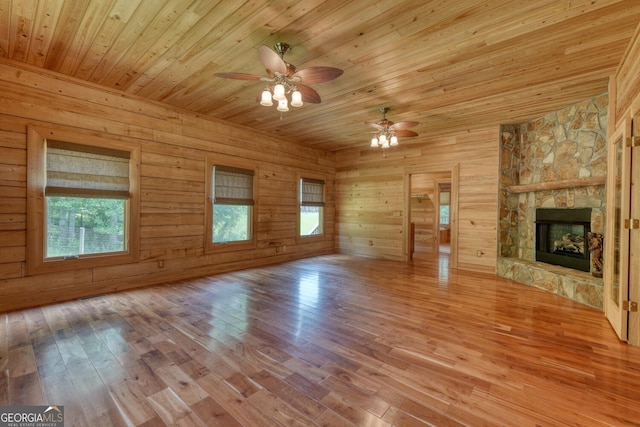 130 Stablegate Dr, Blairsville, GA 30512 - unfurnished living room with ceiling fan, wooden ceiling, hardwood / wood-style flooring, healthy amount of natural light, and a stone fireplace