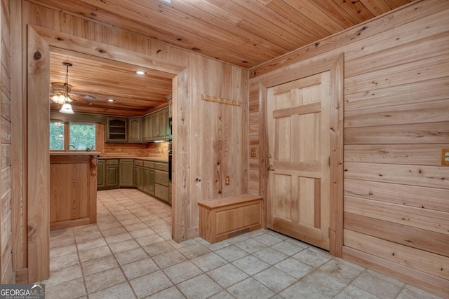 130 Stablegate Dr, Blairsville, GA 30512 - kitchen with wooden ceiling, wooden walls, light tile patterned flooring, recessed lighting, and light countertops