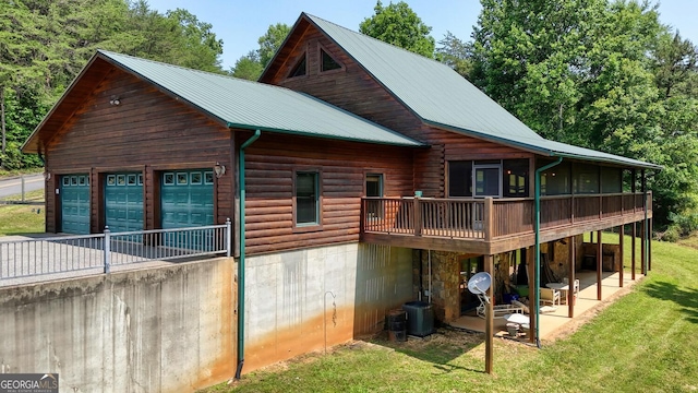 130 Stablegate Dr, Blairsville, GA 30512 - back of property with a deck, a lawn, a patio, and a metal roof