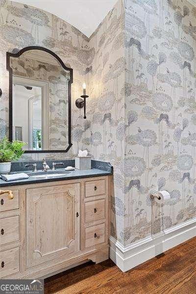 bathroom with vanity and hardwood / wood-style floors