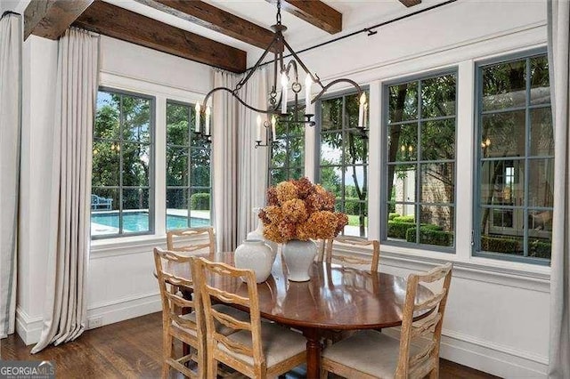 sunroom with beam ceiling and a notable chandelier