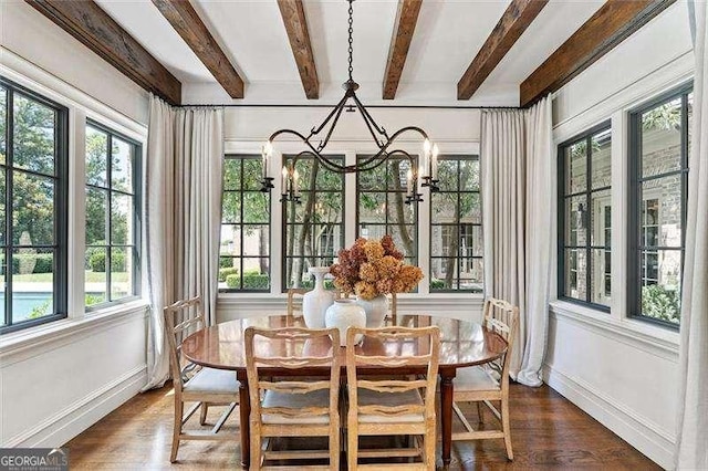 sunroom with an inviting chandelier, a wealth of natural light, and beam ceiling