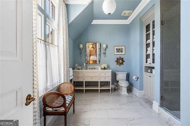 bathroom with a shower with shower door, toilet, vanity, and crown molding